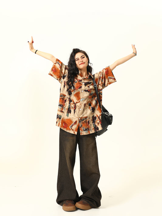 Confident woman wearing vintage-inspired abstract shirt and wide-leg pants from Belle Vestige’s Bold & Confident Collection. Discover timeless fashion with a modern twist that elevates your everyday look.